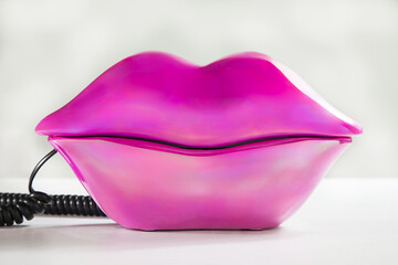 Pink lips telephone representing retro pop art communication