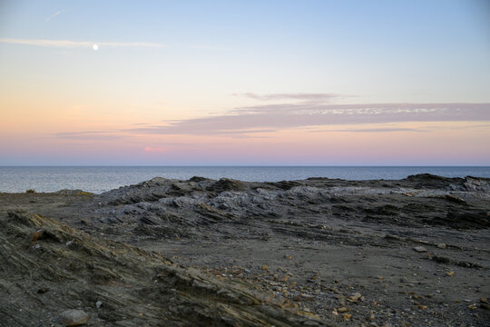 Coastal rocks and moonrise over the Mediterranean near Favàritx, Menorca, Spain