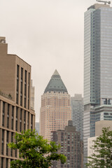 Urban photography capturing diverse New York buildings with cityscape and city life background