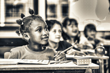 Elementary school classroom with diverse group of children attentively listening to a lesson