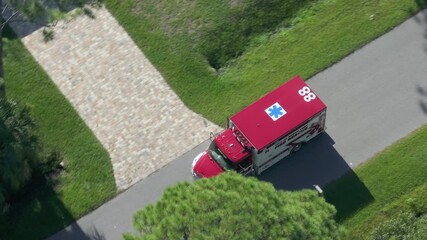 Fire rescue truck drive on Florida road. Emergency service vehicle on city street in USA.