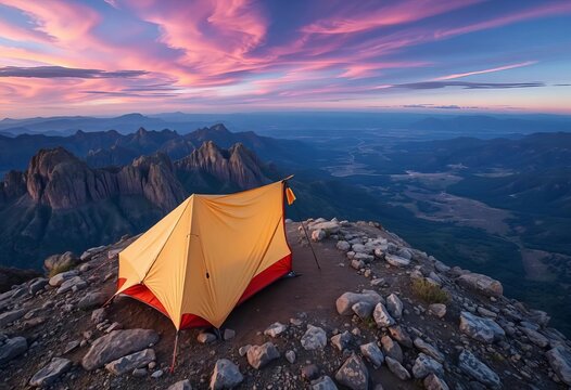 A sturdy tent pitched on a rocky outcrop, overlooking a vast wilderness,  wilderness,  rocky