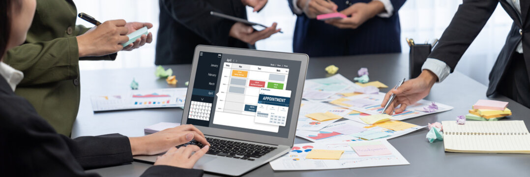 Analyst team use sticky note for creative and analytic brainstorm for business idea with BI data dashboard on laptop screen. Analysis financial data visualization tech for marketing strategy. Prodigy - Powered by Adobe
