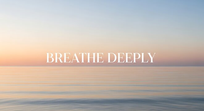 Calm ocean at sunset with breathe deeply text overlay, inspiring mindfulness and relaxation for mental health and wellbeing concept