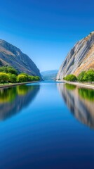 Serene Blue Water Reflecting Majestic Rocky Mountains Under a Clear Summer Sky