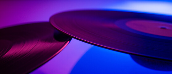 Multicolored vinyl discs for a music banner background