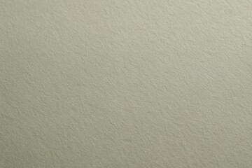 Subtle textured beige background offers organic and natural feel perfect for elegant design projects and soothing visual content.