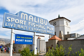 Old, historic Malibu Beach Pier sign along the Pacific Coast Highway in Los Angeles County, Southern California. 