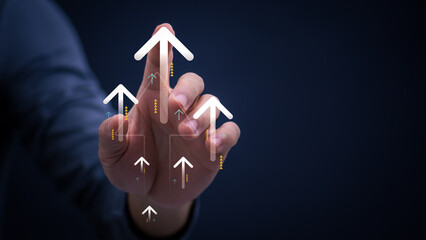 A businessman is pointing an arrow upwards to represent growth, success, and financial progress of the business, improving efficiency and increasing profits in the modern digital analytics concept.