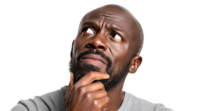 Introspective Thought: A close-up shot of a man deep in thought, with a furrowed brow and a hand thoughtfully resting on his chin, gazing upwards as he wrestles with a complex idea. 