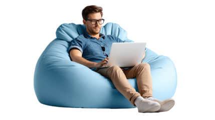 Man working on laptop in beanbag chair: A focused man with glasses engrossed in his laptop sits comfortably in a plush beanbag chair, presenting an image of relaxed productivity and modern living.