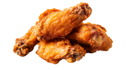A close up shot of a small pile of golden brown crispy fried chicken wings on a black background