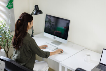 Freelance lifestyles working at home office concept. Asian woman using computer productive time manage. 

