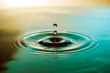 Macro Water Droplets Creating Ripples on Surface Calm Liquid Motion Concept