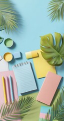 Pastel stationery and tropical leaves on a light blue background