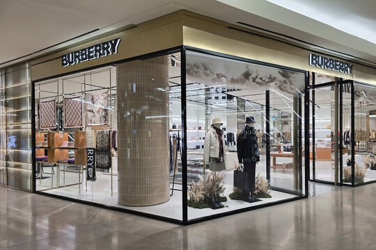 Kuala Lumpur, Malaysia &ndash; Sep 14, 2025: Exterior view of the Burberry boutique showcasing luxury fashion items, patterned scarves, designer apparel, and modern retail interior.