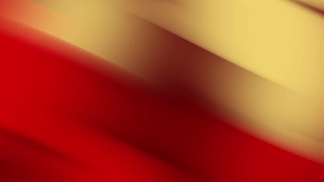 Abstract animated background featuring a smooth gradient of red, orange, and gold tones with soft diagonal motion. - Powered by Adobe