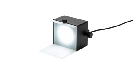 Small black light box with bright white light source isolated on a transparent background