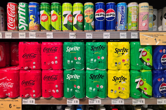 Kuala Lumpur, Malaysia &ndash; Sep 14, 2025: A variety of canned and multipack soft drinks displayed on the beverage shelf in Jaya Grocer.