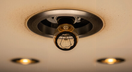 Burnt-out light bulb in recessed ceiling fixture