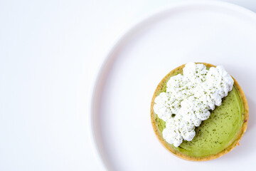 Matcha cheese tart on a white plate