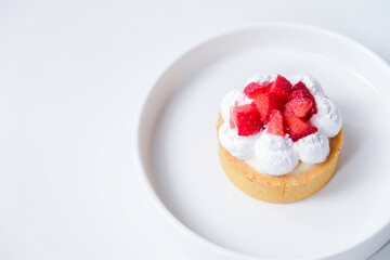 Strawberry cheese tart on a white plate