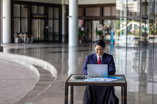 Young professional embraces digital business transformation, using tablet technology to drive innovation, next-generation solutions, and future-focused leadership in a modern workplace.