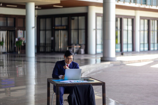 Young professional embraces digital business transformation, using tablet technology to drive innovation, next-generation solutions, and future-focused leadership in a modern workplace.