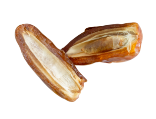 Ripe dried date palm fruits in two halves in stack isolated with clipping path in png file format Concept of iftar food in Ramadan month for Muslims