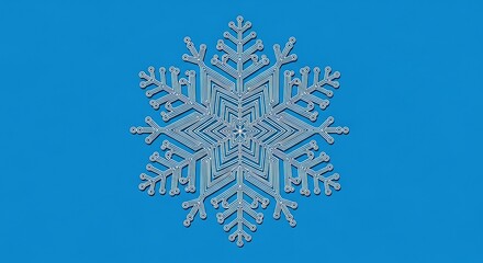 Intricate snowflake design resembling a circuit board on a blue background for technology and winter holiday themes and creative projects