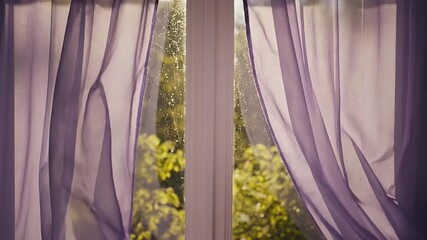 Sheer purple curtains gently blowing in the breeze revealing a lush green garden outside. - Powered by Adobe