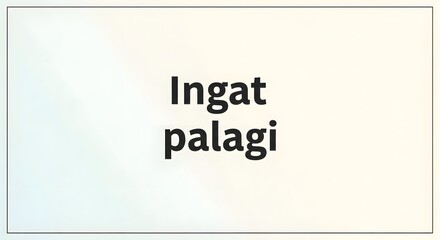 A minimalistic white sign with bold black text displaying the phrase 'Ingat palagi' in a clean, modern font on a plain background