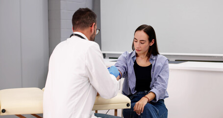 Health Check: Female Doctor Drawing Blood Sample