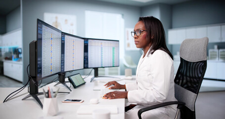 Diligent African American Doctor Manages Medical Billing Coding Audit Online