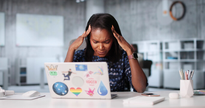 Overworked African American Businesswoman Feeling Ill And Stressed