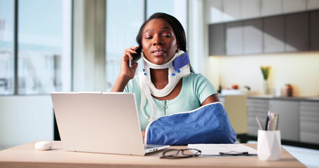 Woman With Broken Arm Injured In Accident Using Phone And Laptop