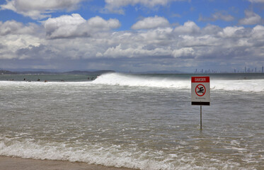 Dangerous waves at Coolangatta Beach, Gold Coast, Queensland, Australia.