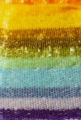 Beads. Multicolored beadwork. Rainbow glittering background.