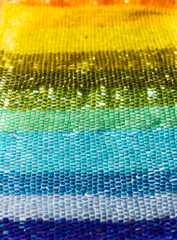 Beads. Multicolored beadwork. Rainbow glittering background.