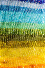 Beads. Multicolored beadwork. Rainbow glittering background.