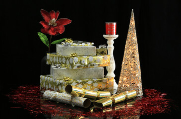 Decorative Christmas presents on black reflective surface