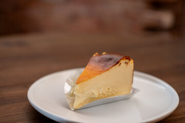 Burnt Basque cheesecake served on plate on the table