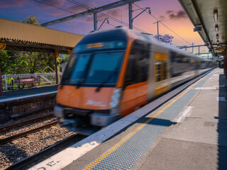 Obraz premium Passenger Train going through Summer Hill train station a suburban Sydney train Station NSW Australia