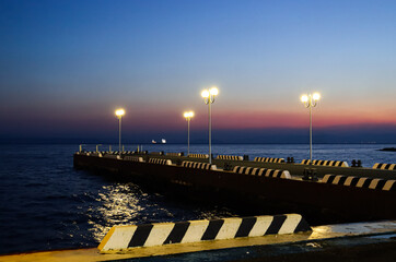 Vladivostok in the evening. Embankment at sunset.