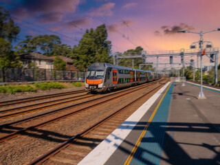 Obraz premium Passenger Train going through Summer Hill train station a suburban Sydney train Station NSW Australia