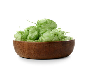 Wooden bowl with fresh green hops on white background