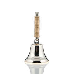 Close up of a silver bell with a golden sparkly handle isolated on a black background with studio lighting.