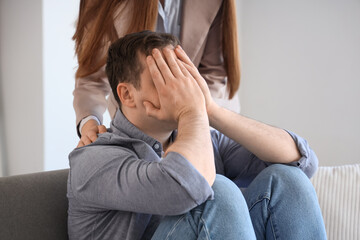 Upset male drug addict visiting psychologist in office