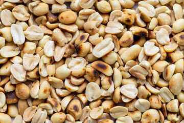 Close-up macro of roasted peanut texture,Close-Up of Shiny Roasted Peanuts Showing Texture and Perfect Crispness.