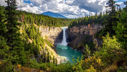 A breathtaking landscape with a massive waterfall cascading into a turquoise river amidst lush green forest and rugged cliffs